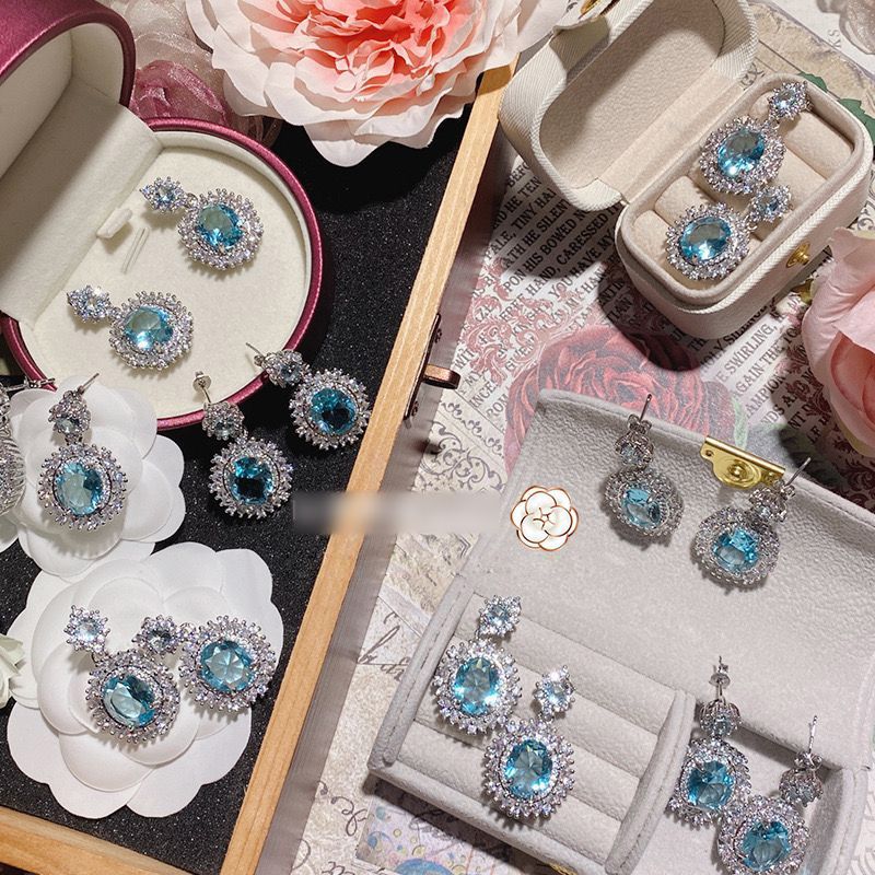 Luxury daughter wind bright luminous sea blue rhinestone earrings anti-allergic full diamond flower Japanese and Korean anti-allergic earrings