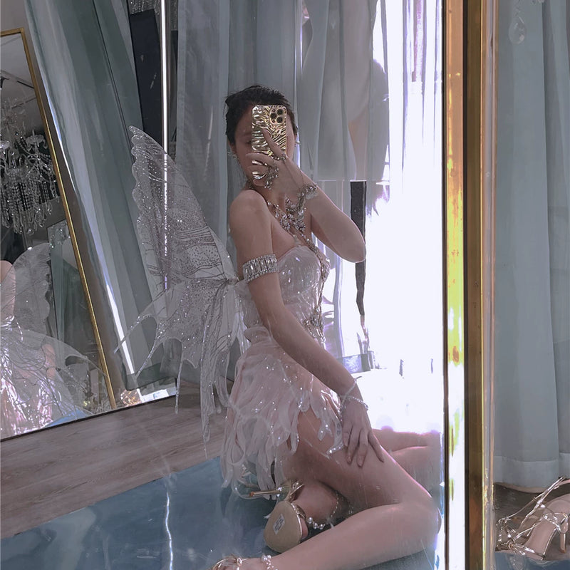 The skin is as cold as ice and the bones are as clear as a river |   Handmade custom sparkling irregular strapless gown with fairy wings