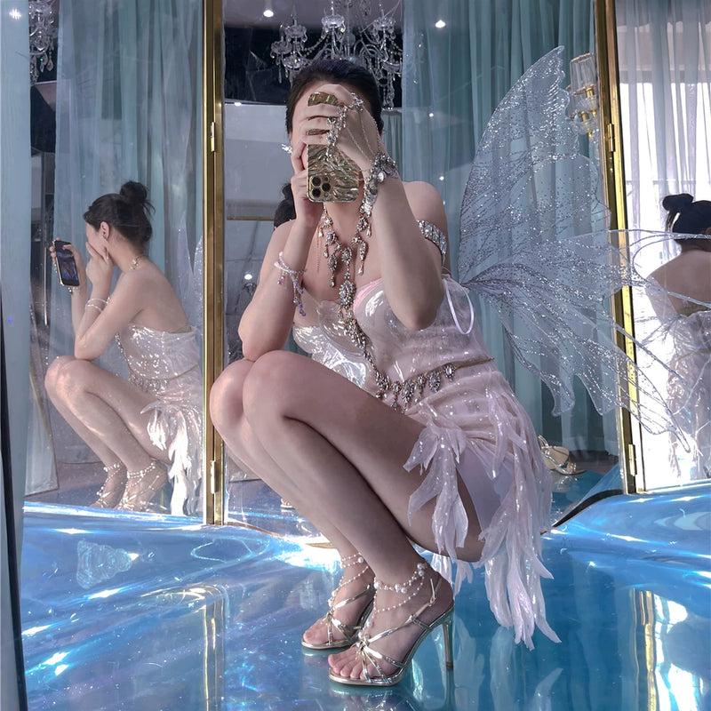 The skin is as cold as ice and the bones are as clear as a river |   Handmade custom sparkling irregular strapless gown with fairy wings