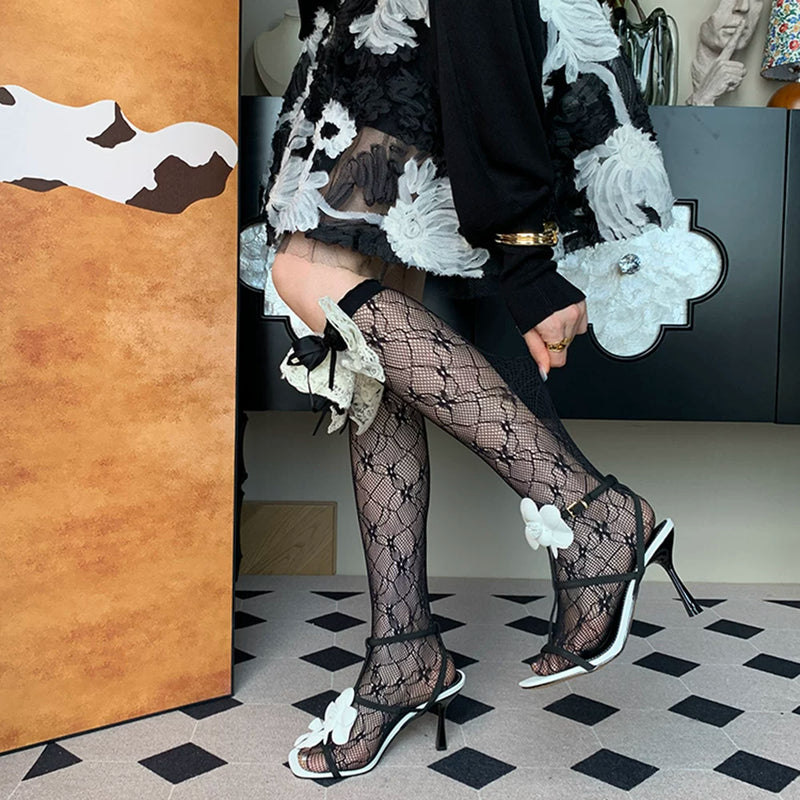2025 autumn new French light luxury sweet romantic elegant niche black bow hollow calf socks women DF
