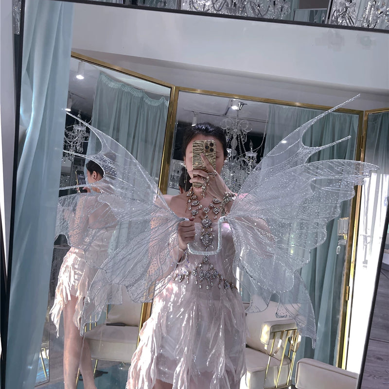 The skin is as cold as ice and the bones are as clear as a river |   Handmade custom sparkling irregular strapless gown with fairy wings