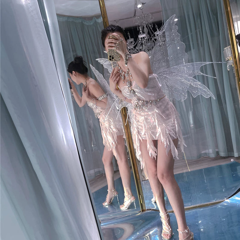 The skin is as cold as ice and the bones are as clear as a river |   Handmade custom sparkling irregular strapless gown with fairy wings