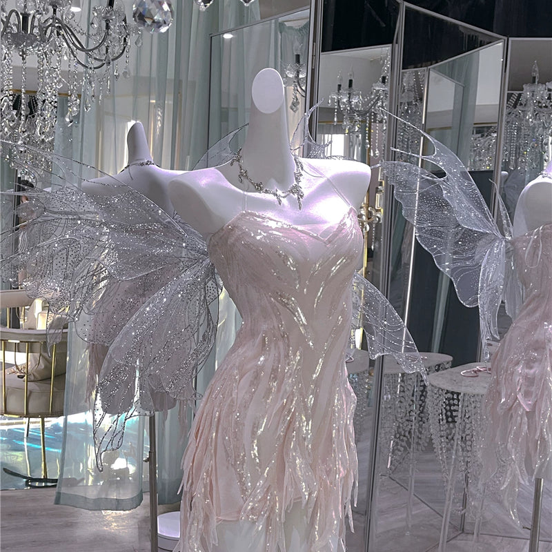 The skin is as cold as ice and the bones are as clear as a river |   Handmade custom sparkling irregular strapless gown with fairy wings