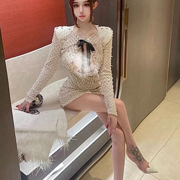 French light luxury celebrity daughter gold bow heavy industry pearl hip wrap long-sleeved dress pure desire hollow temperament short skirt