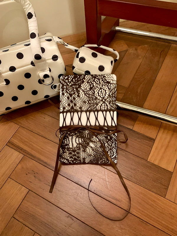 Niche design brand hollow white drawstring pantyhose women's autumn new light and mature fashion wear