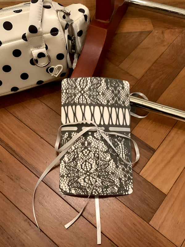 Niche design brand hollow white drawstring pantyhose women's autumn new light and mature fashion wear