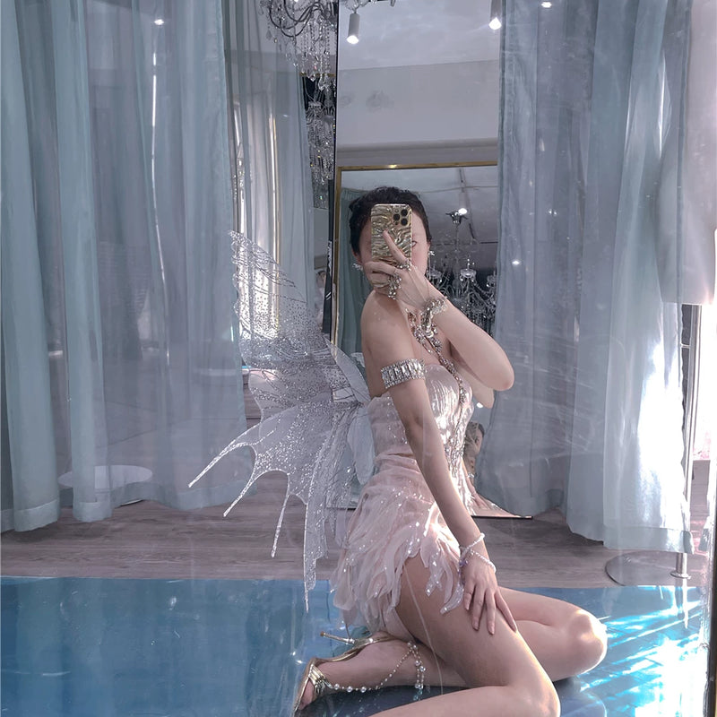 The skin is as cold as ice and the bones are as clear as a river |   Handmade custom sparkling irregular strapless gown with fairy wings