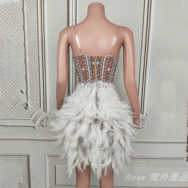 Elegant white swan-inspired feather skirt dress - slimming, rhinestone embellished mini dress for vacation, runway, party, and evening events