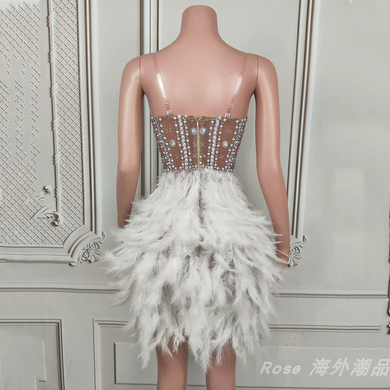 Elegant white swan-inspired feather skirt dress - slimming, rhinestone embellished mini dress for vacation, runway, party, and evening events