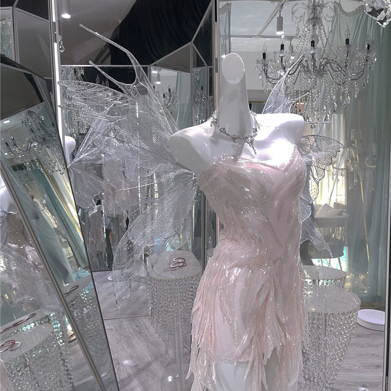 The skin is as cold as ice and the bones are as clear as a river |   Handmade custom sparkling irregular strapless gown with fairy wings