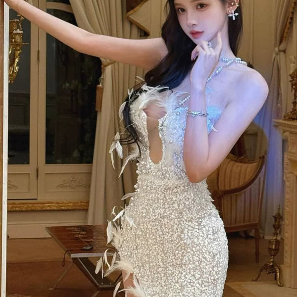 Elegant birthday party gown: strapless, heavy beaded & pearl embellished, high-slit feather evening dress