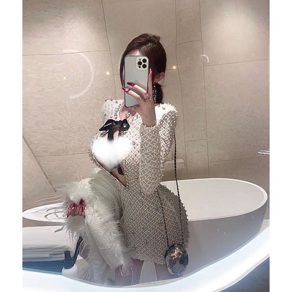 French light luxury celebrity daughter gold bow heavy industry pearl hip wrap long-sleeved dress pure desire hollow temperament short skirt