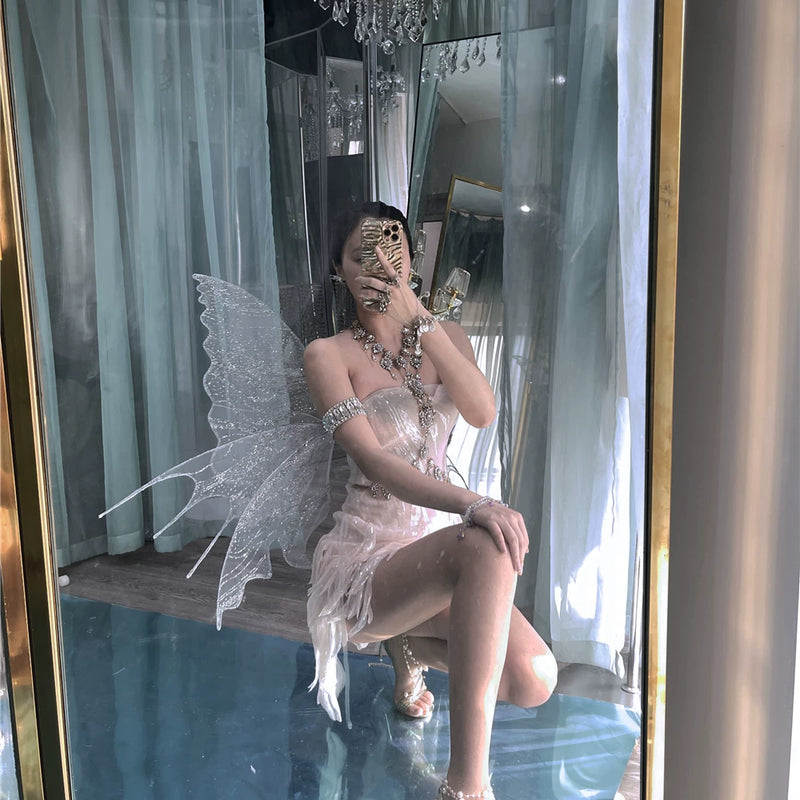 The skin is as cold as ice and the bones are as clear as a river |   Handmade custom sparkling irregular strapless gown with fairy wings