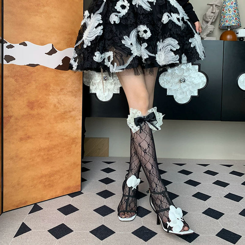 2025 autumn new French light luxury sweet romantic elegant niche black bow hollow calf socks women DF
