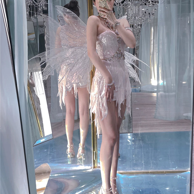 The skin is as cold as ice and the bones are as clear as a river |   Handmade custom sparkling irregular strapless gown with fairy wings