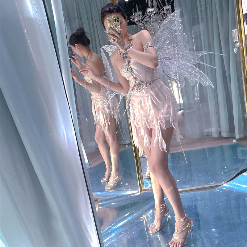 The skin is as cold as ice and the bones are as clear as a river |   Handmade custom sparkling irregular strapless gown with fairy wings